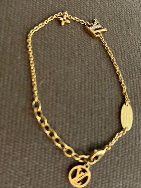 Louis Vuitton Gold Tone Signature Iconic Charm Bracelet.